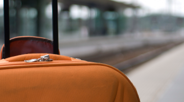 Suitcase waiting at a train station